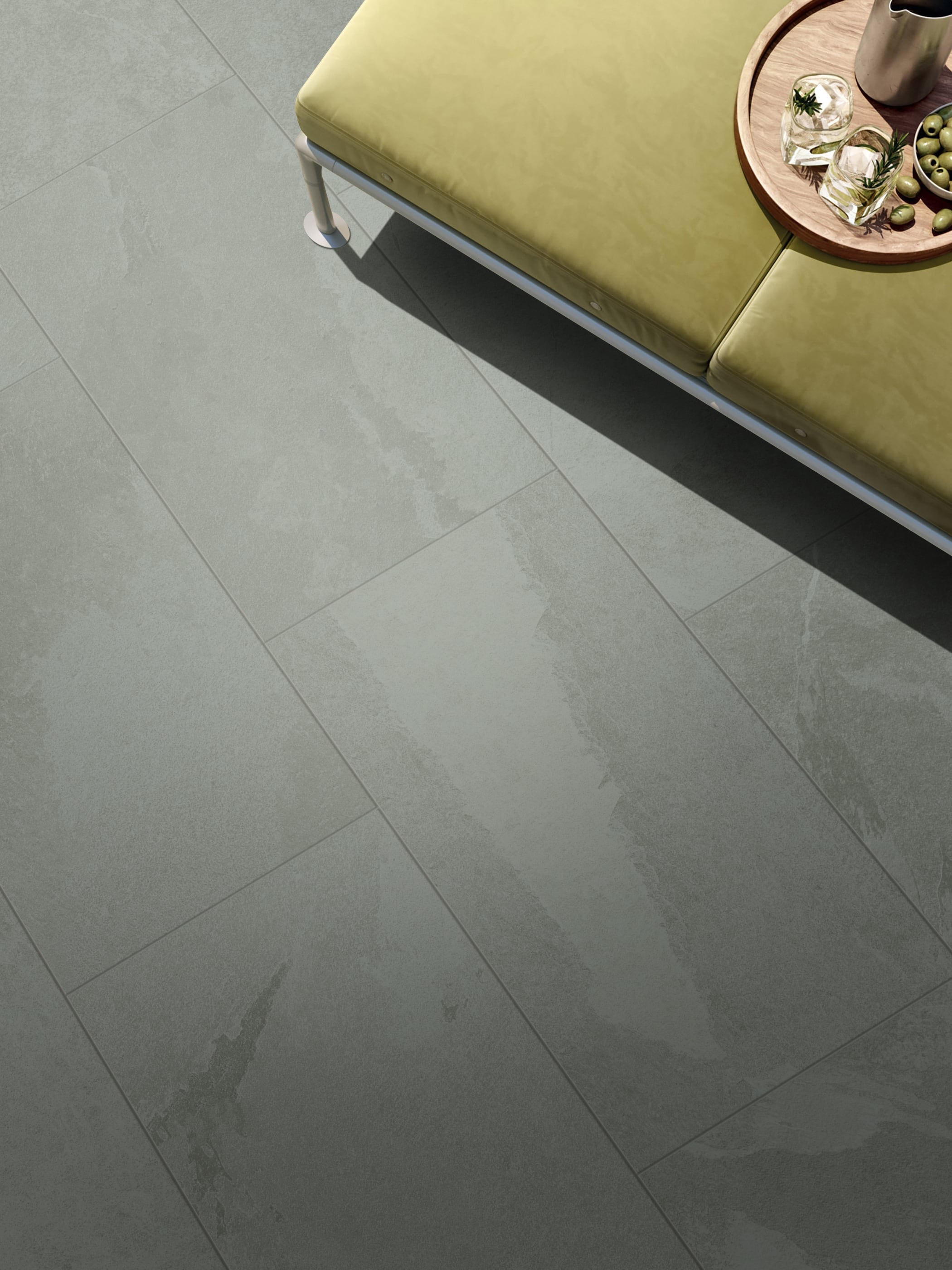 NetZero Ardesia color porcelain tile floor with couch on top